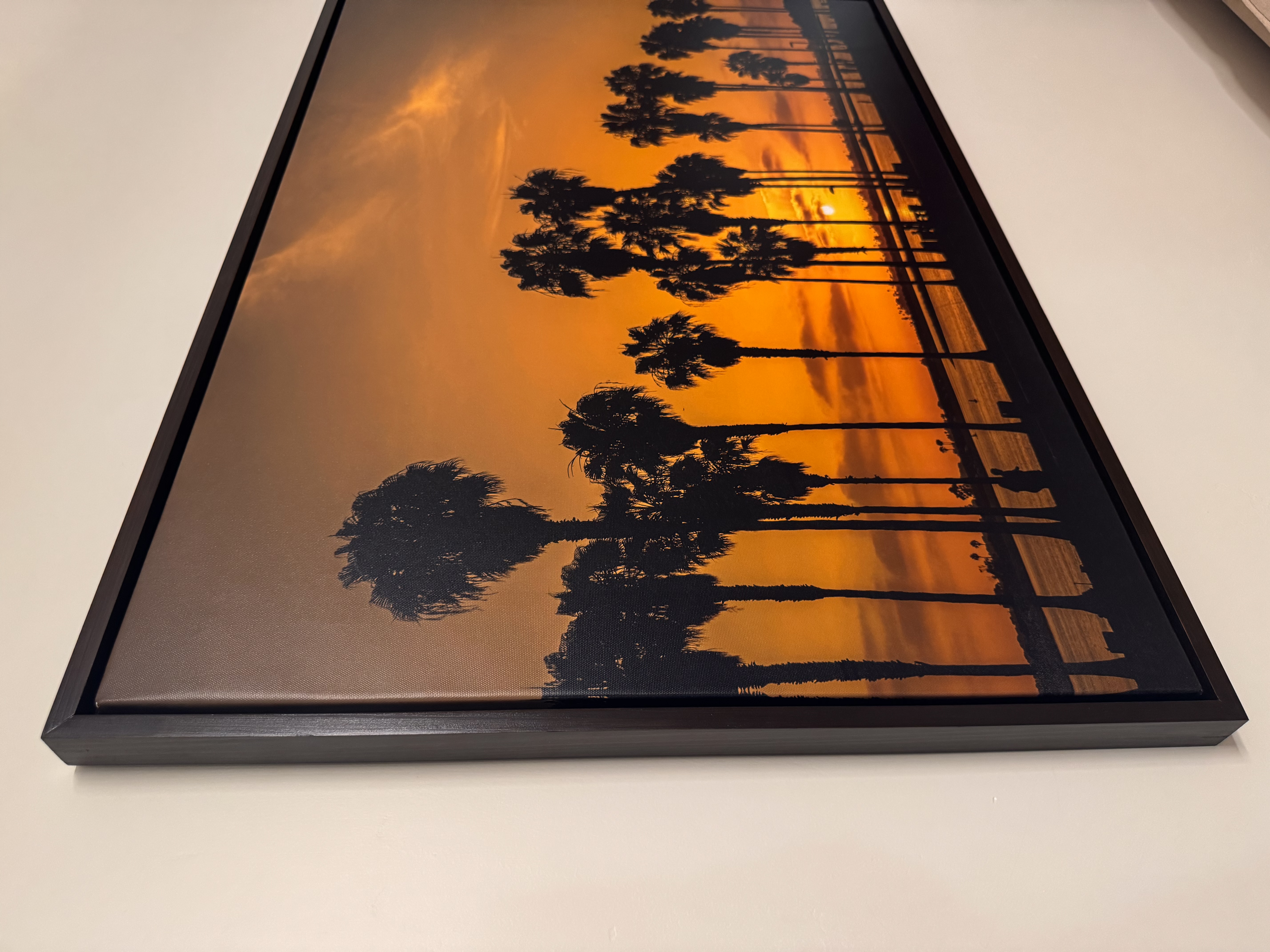 Floating canvas frame — black finish, side view